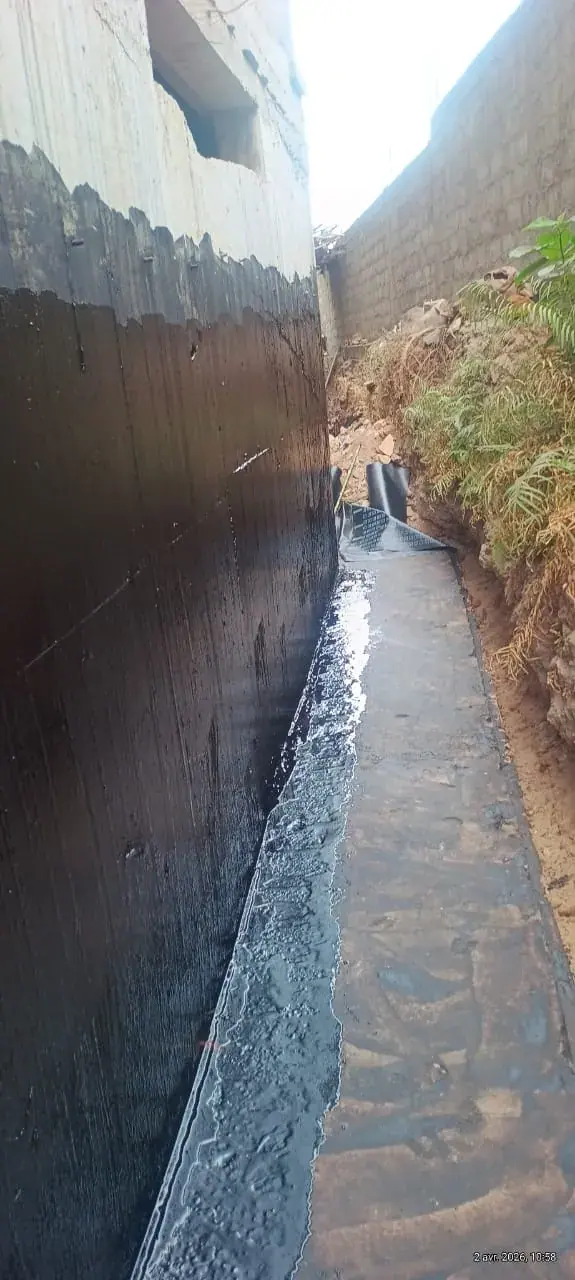 Trench alongside the wall